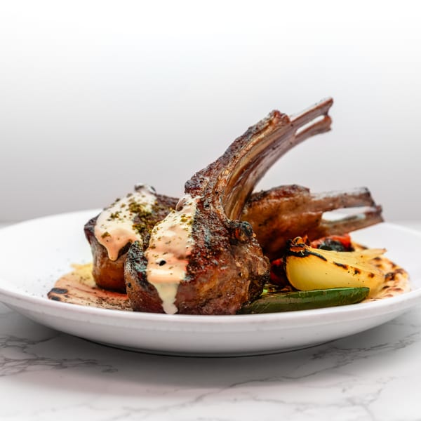 Beautifully plated lamb chops at Cracked Pepper Bistro.