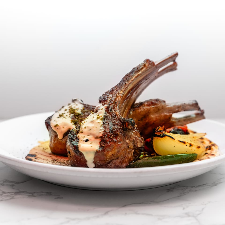 Beautifully plated lamb chops at Cracked Pepper Bistro.